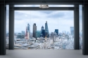 Office interior with London city background